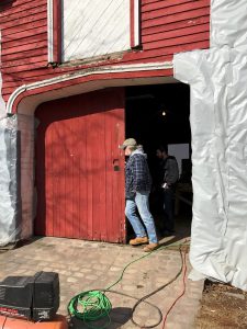 Mike opens barn door